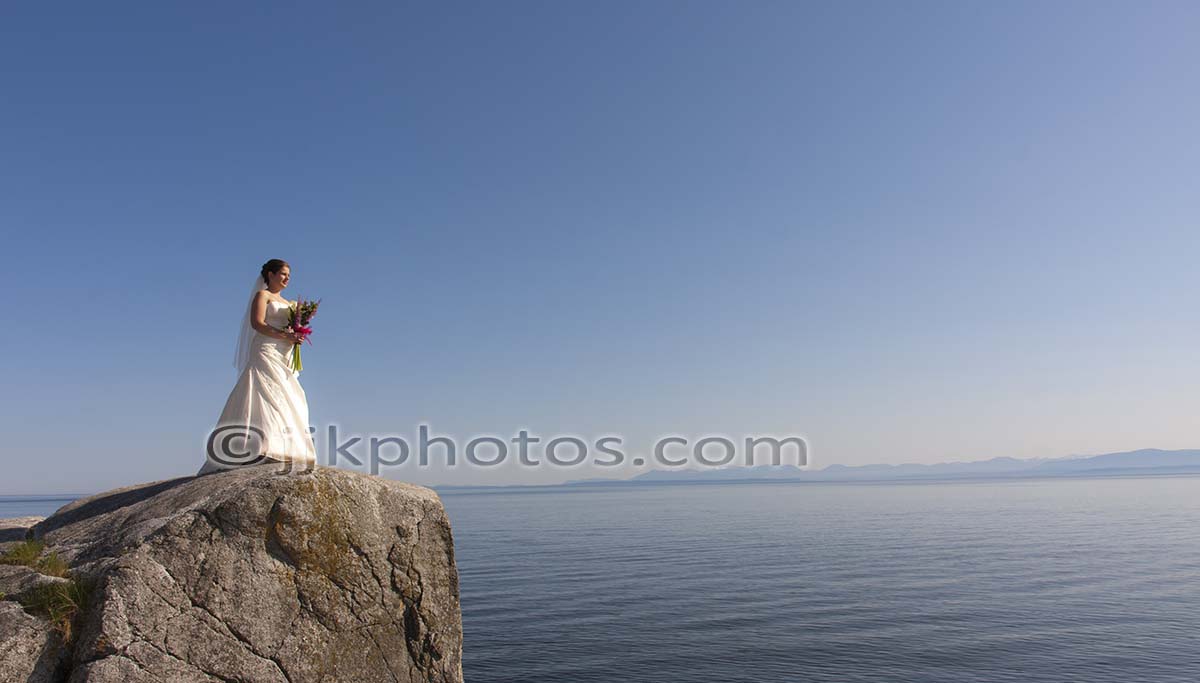 Bride and groom seaside portrait